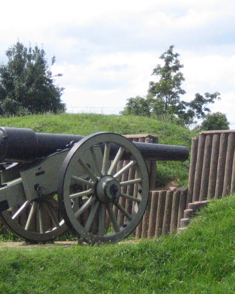 Fort Stevens earthworks and a replica cannon in Brightwood